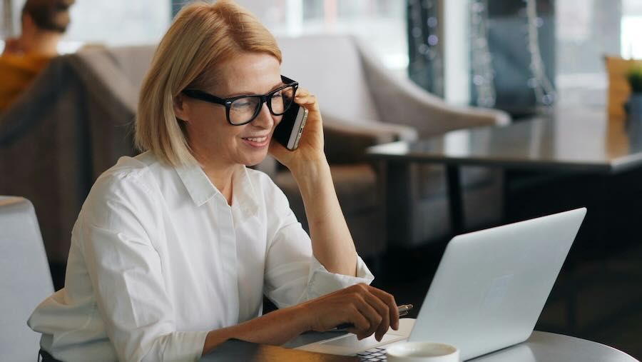 Business woman on the phone with a web design company