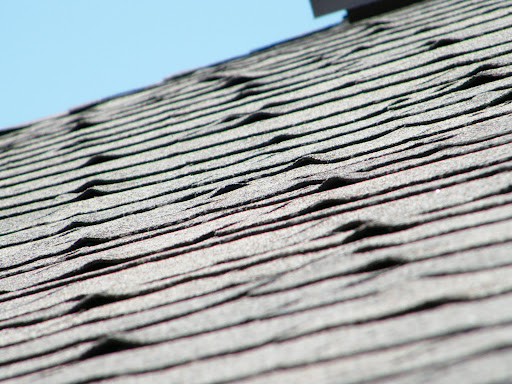 a close up of a roof with a blue sky in the background .