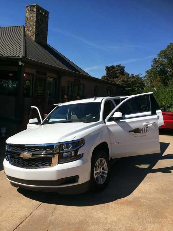 white car with doors open