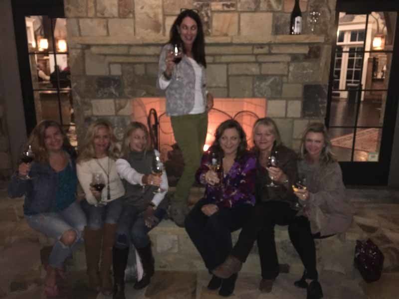 group of women holding drinks