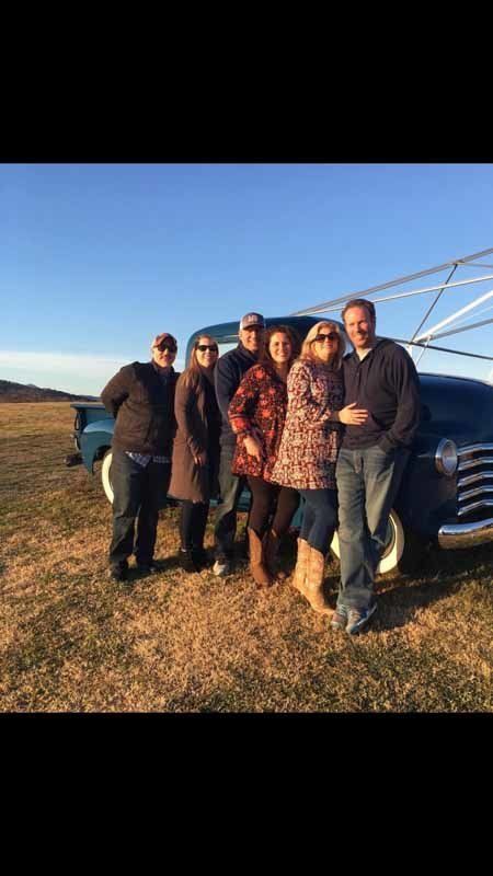 group of people in front of truck