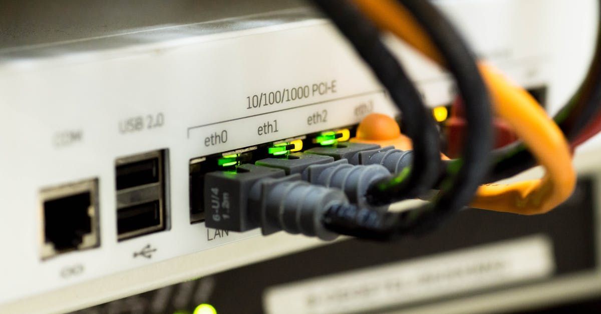 A close up of a router with a bunch of wires connected to it