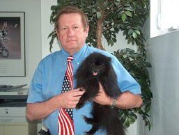 Veterinarian Holding A Dog — Hampton VA — Armistead Avenue Veterinary Hospital