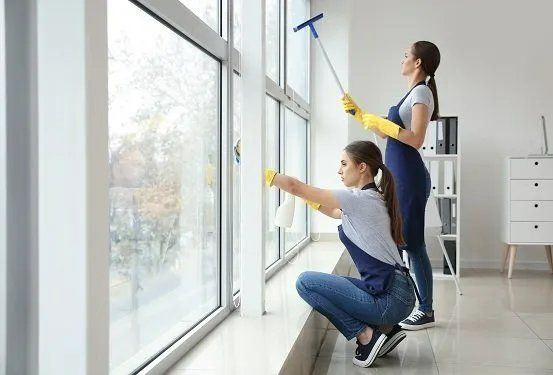 Professional cleaners cleaning a commercial office building in Mackay QLD.