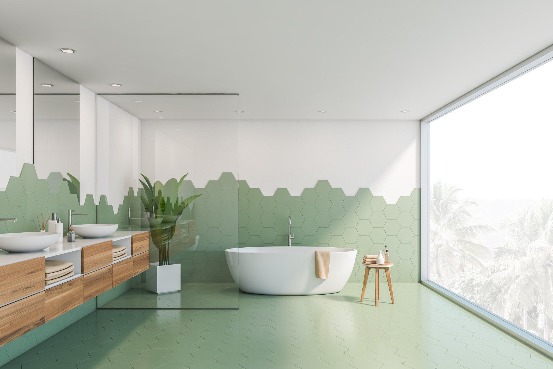 A bathroom with green tiles , a tub , sinks and a large window.