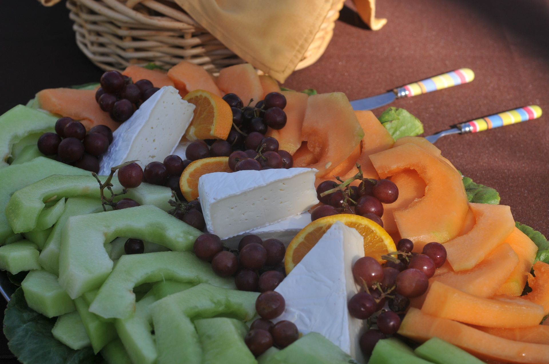 After rafting catering tray with brie cheese, cantaloupe, honey dew, and grapes