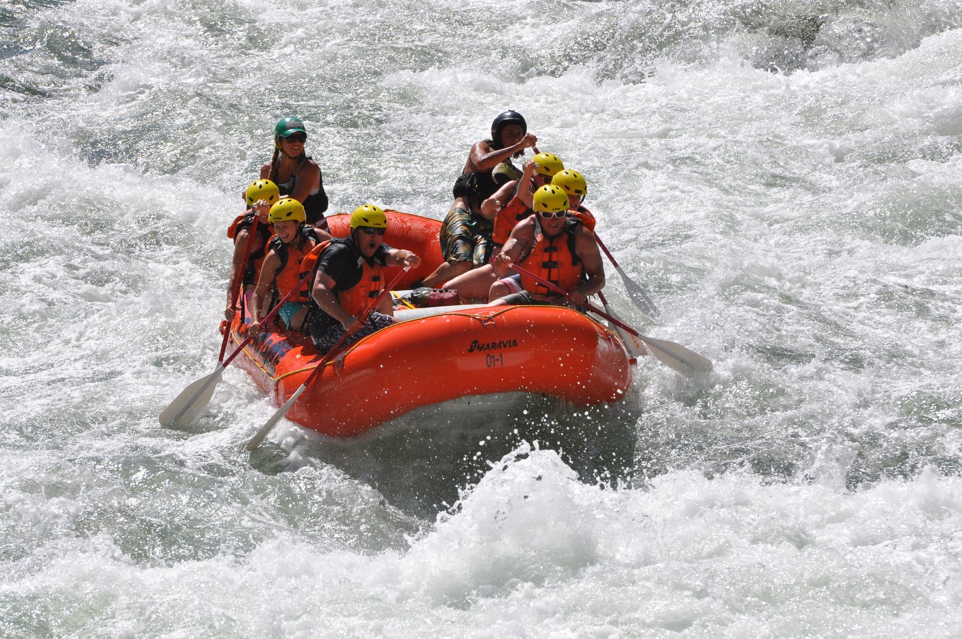 Raft paddling through big waves on the Payette River