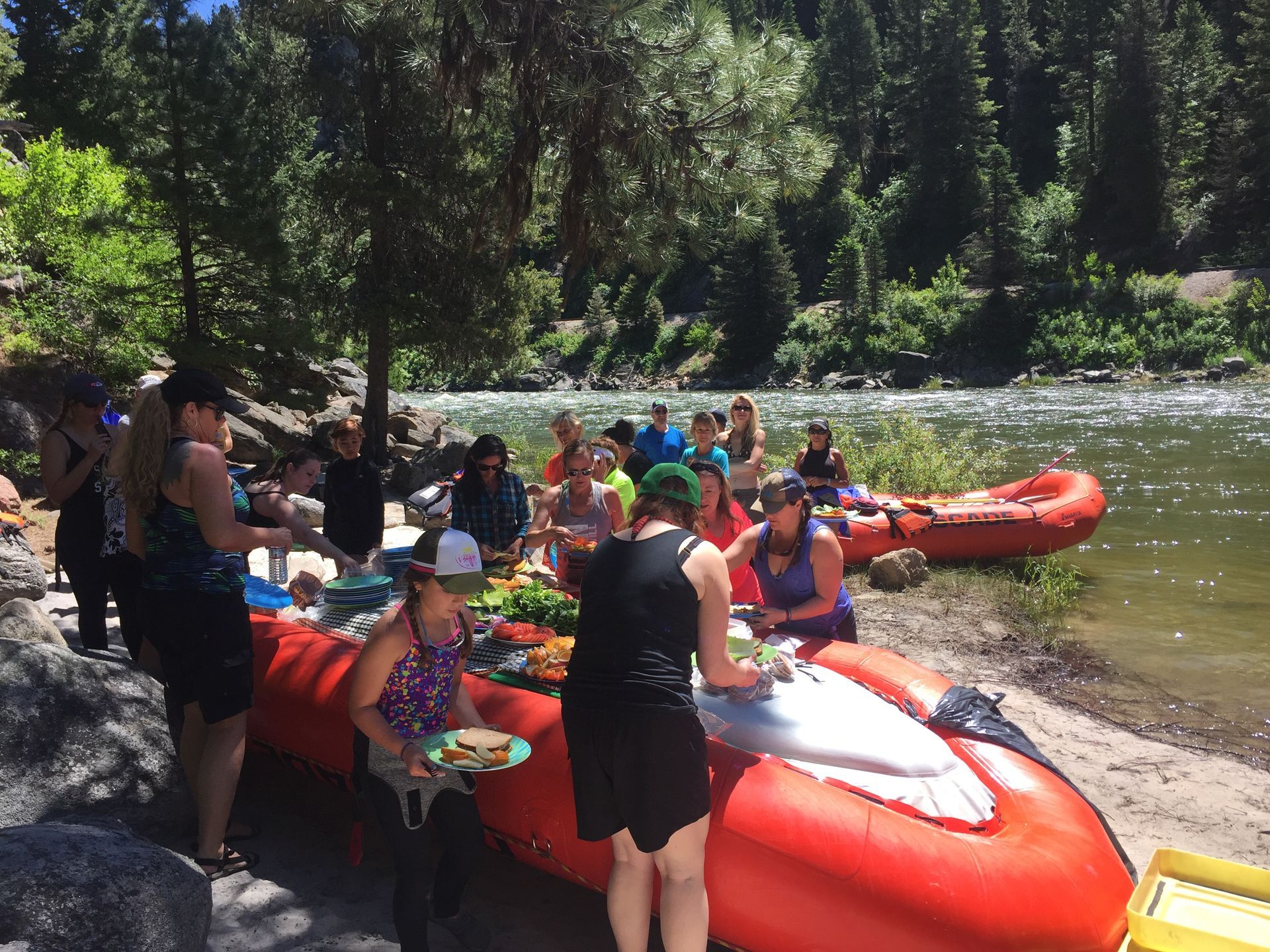 Riverside lunch on whitewater rafts next to Payette River