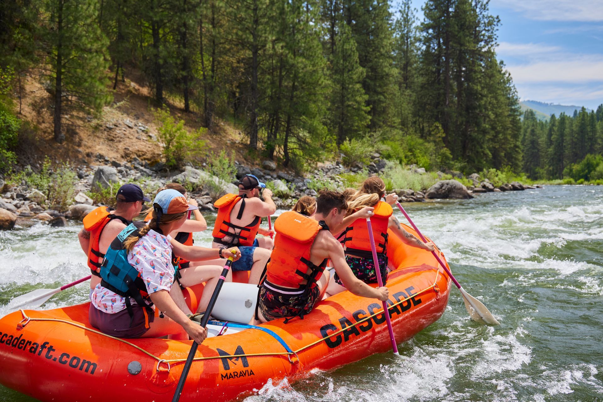 People rafting on mild whitewater