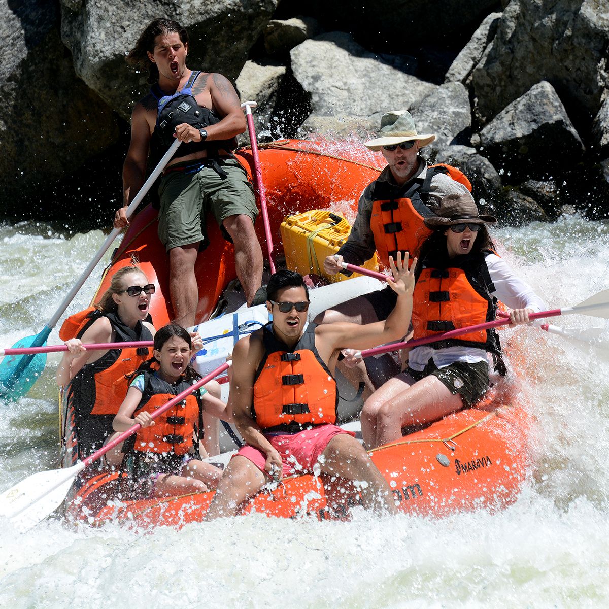Rafting trip on Payette River in rapids and smiling