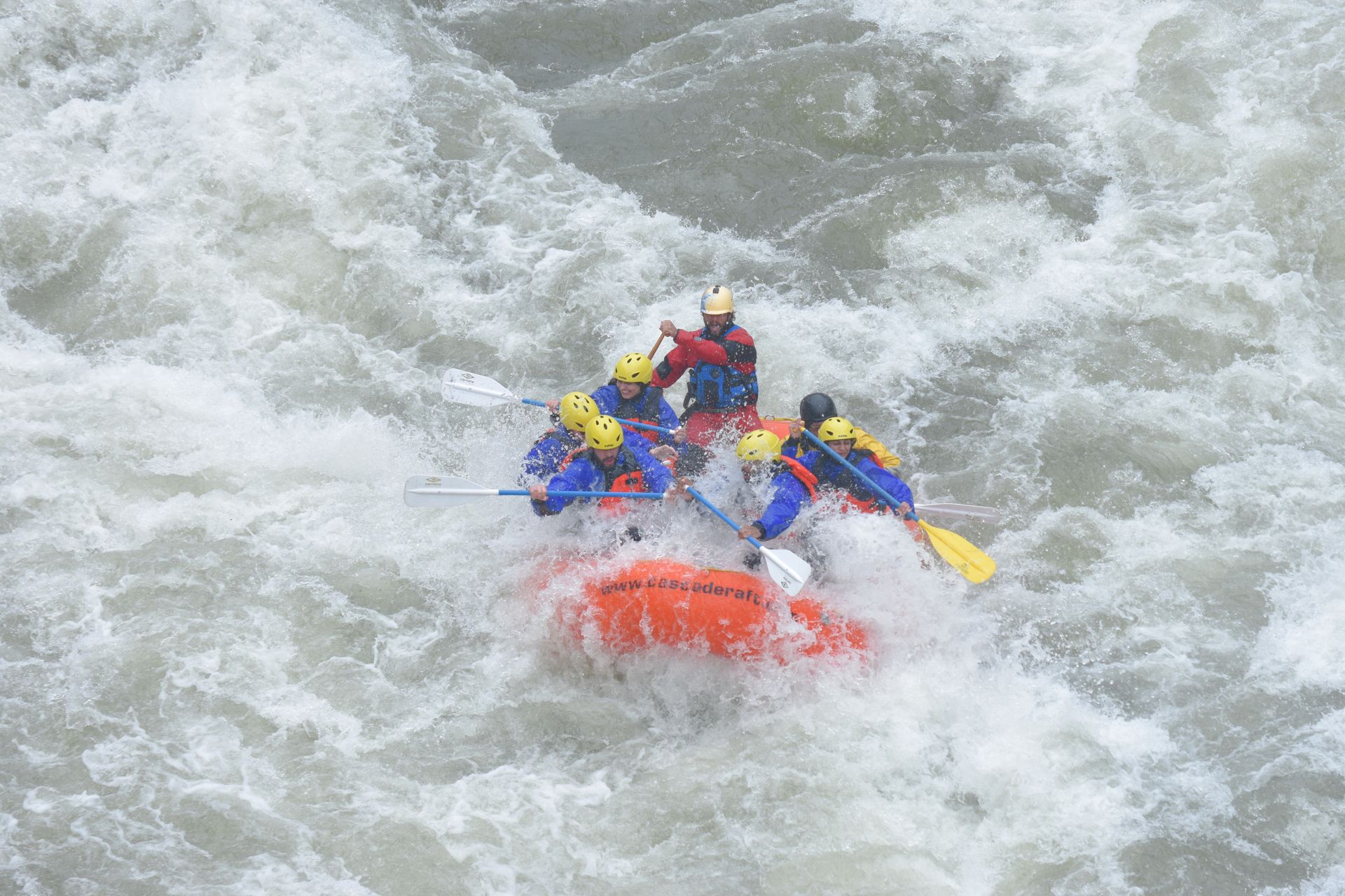 Raft almost underwater in big rapids on the Payette River