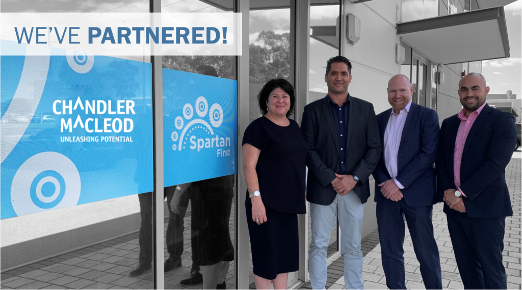 A group of people are standing in front of a building.