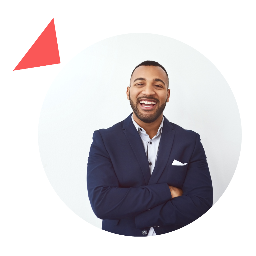 A man in a suit is standing in a circle with his arms crossed and smiling.