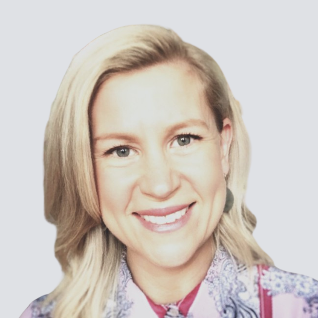 A woman with blonde hair is smiling for the camera