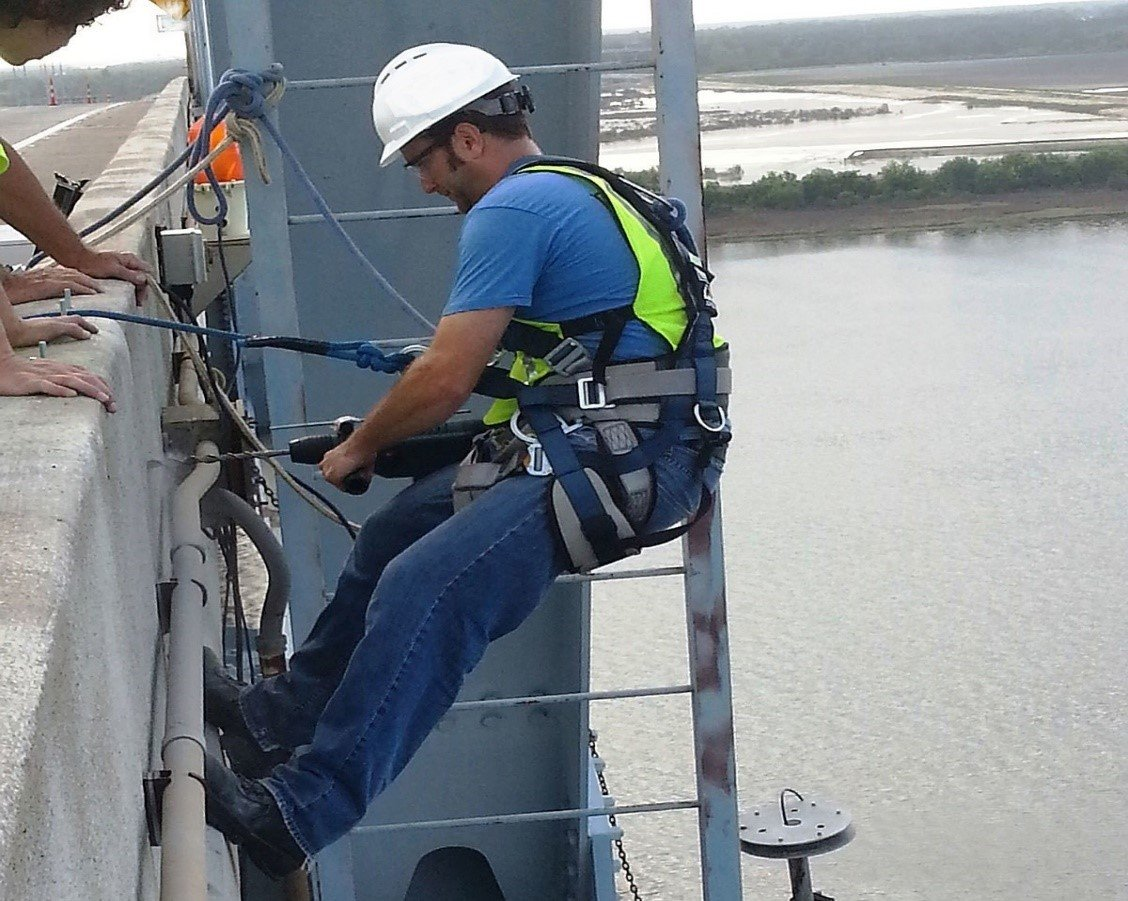 A proper harness worn by someone working at heights.