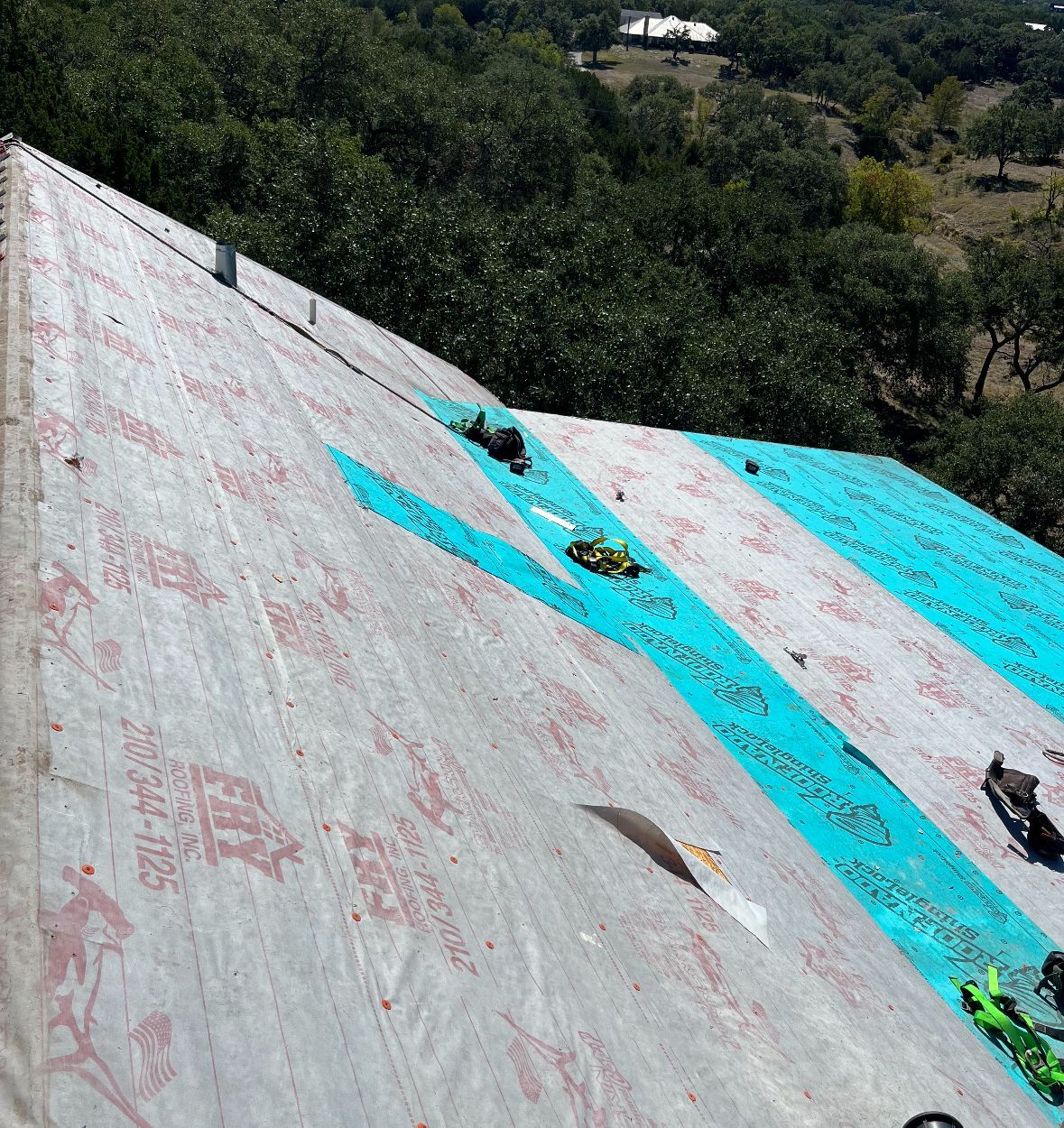 A roof with a lot of trees in the background