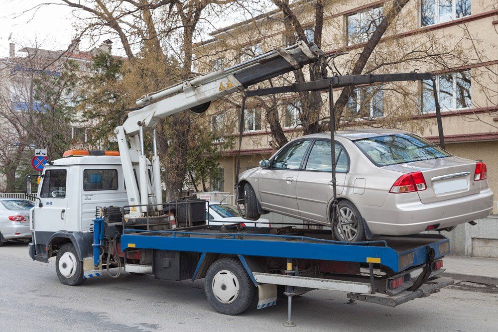 Car Being Towed — Austin, TX — Law Office of Michael Baumer