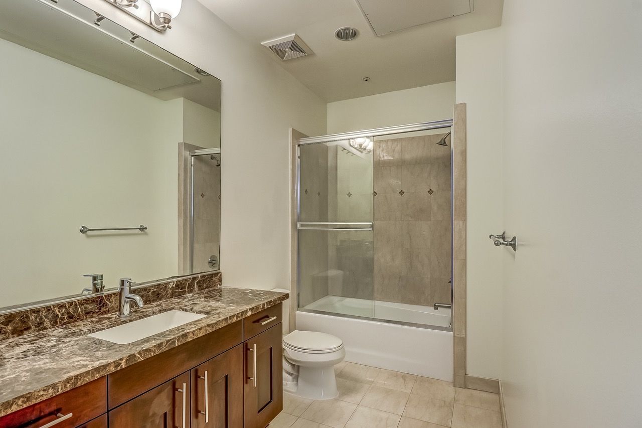 Axis apartment bathroom sink and shower