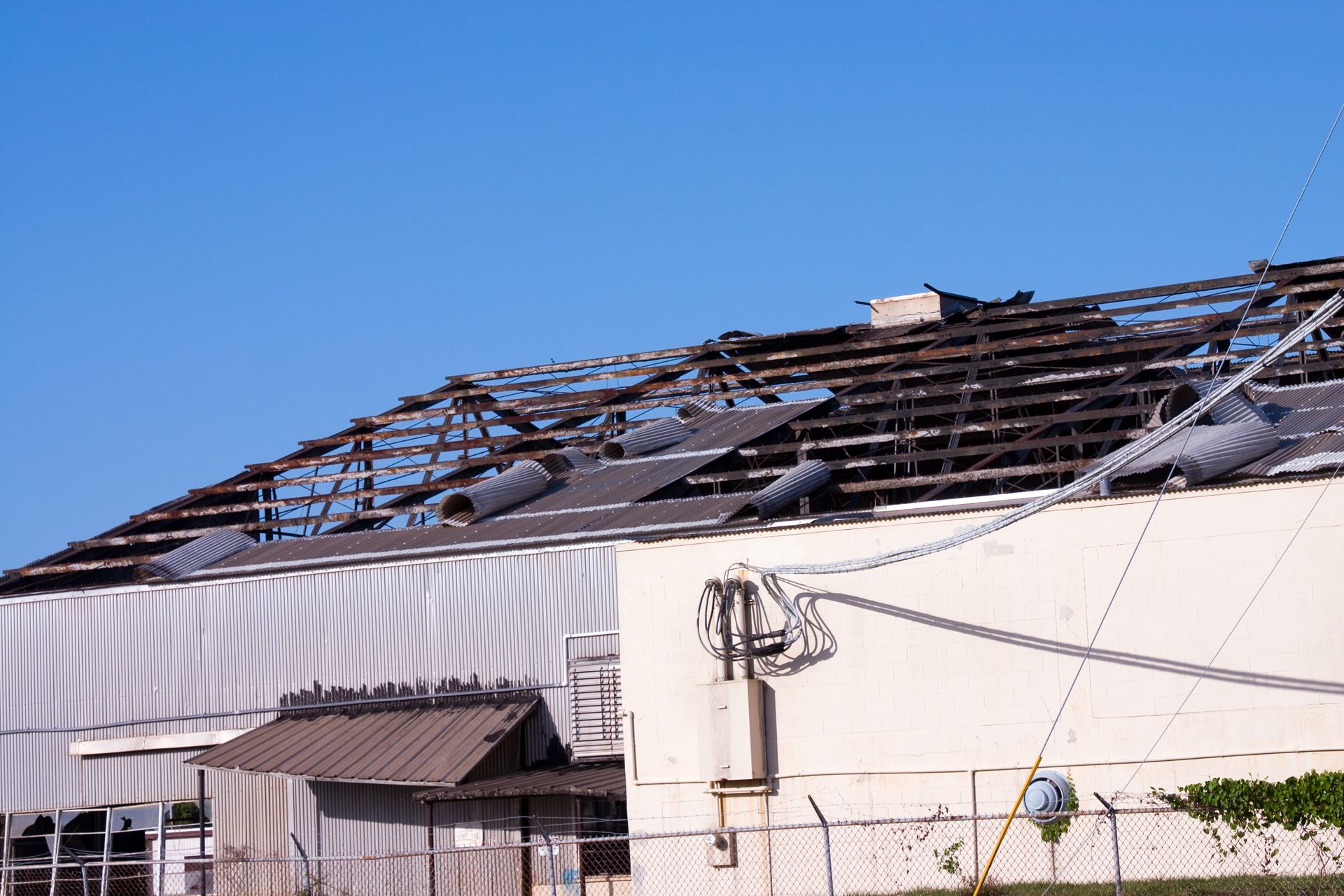 The roof of a building has been damaged by a tornado.