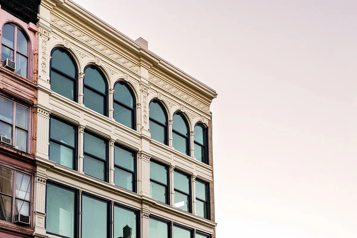 A large building with a lot of windows and arches