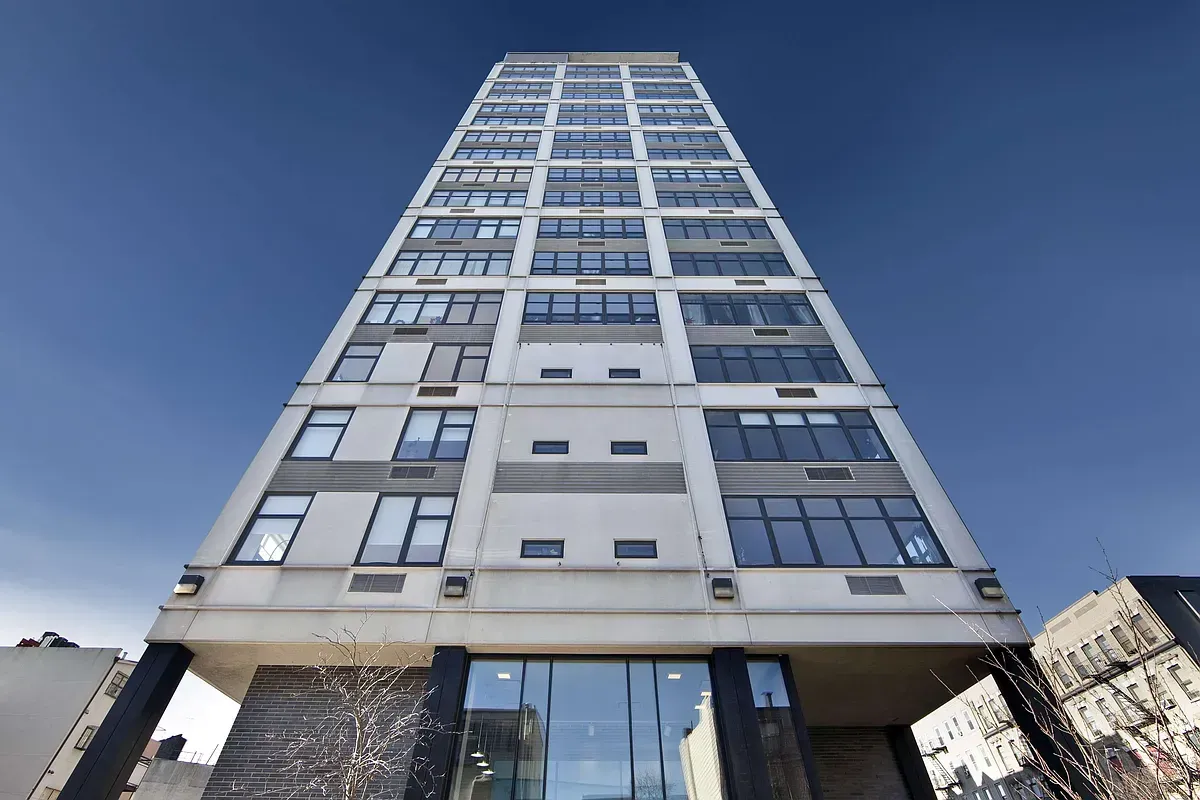 Looking up at a tall building with lots of windows