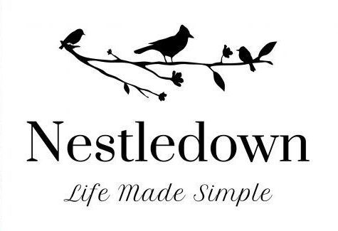 A black and white logo for nestledown life made simple with two birds on a branch.
