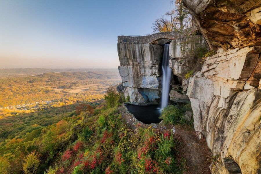 There is a waterfall on the side of a cliff.