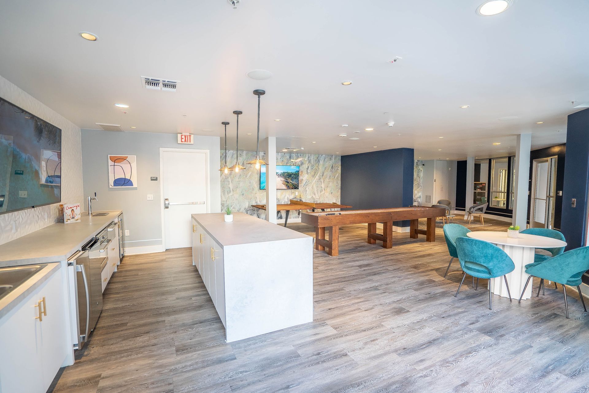 There is a pool table in the middle of the room.