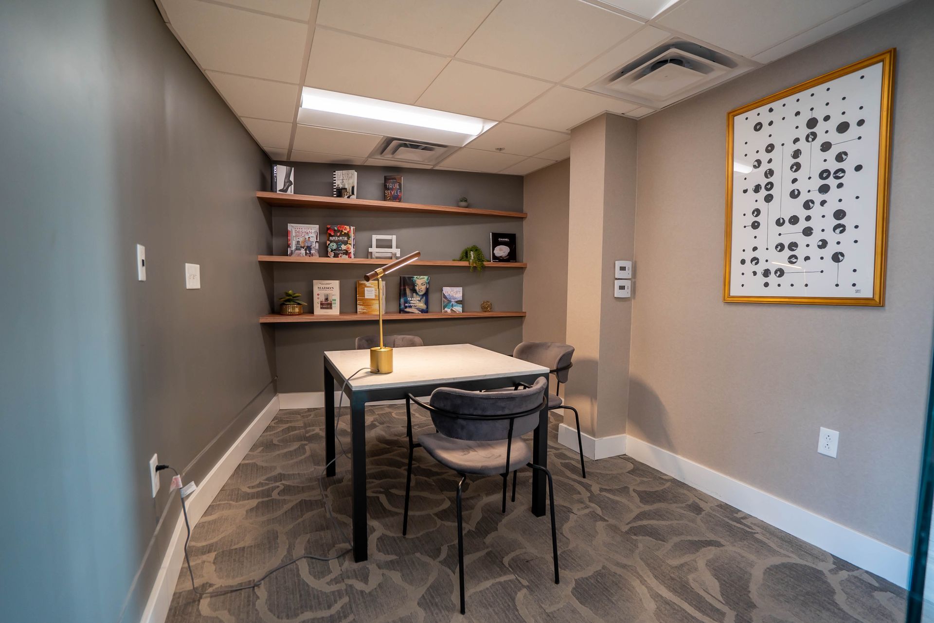 A small room with a table and chairs in it.