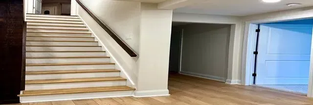 There are stairs leading up to the second floor of a house.