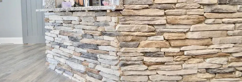A close up of a stone wall in a room.
