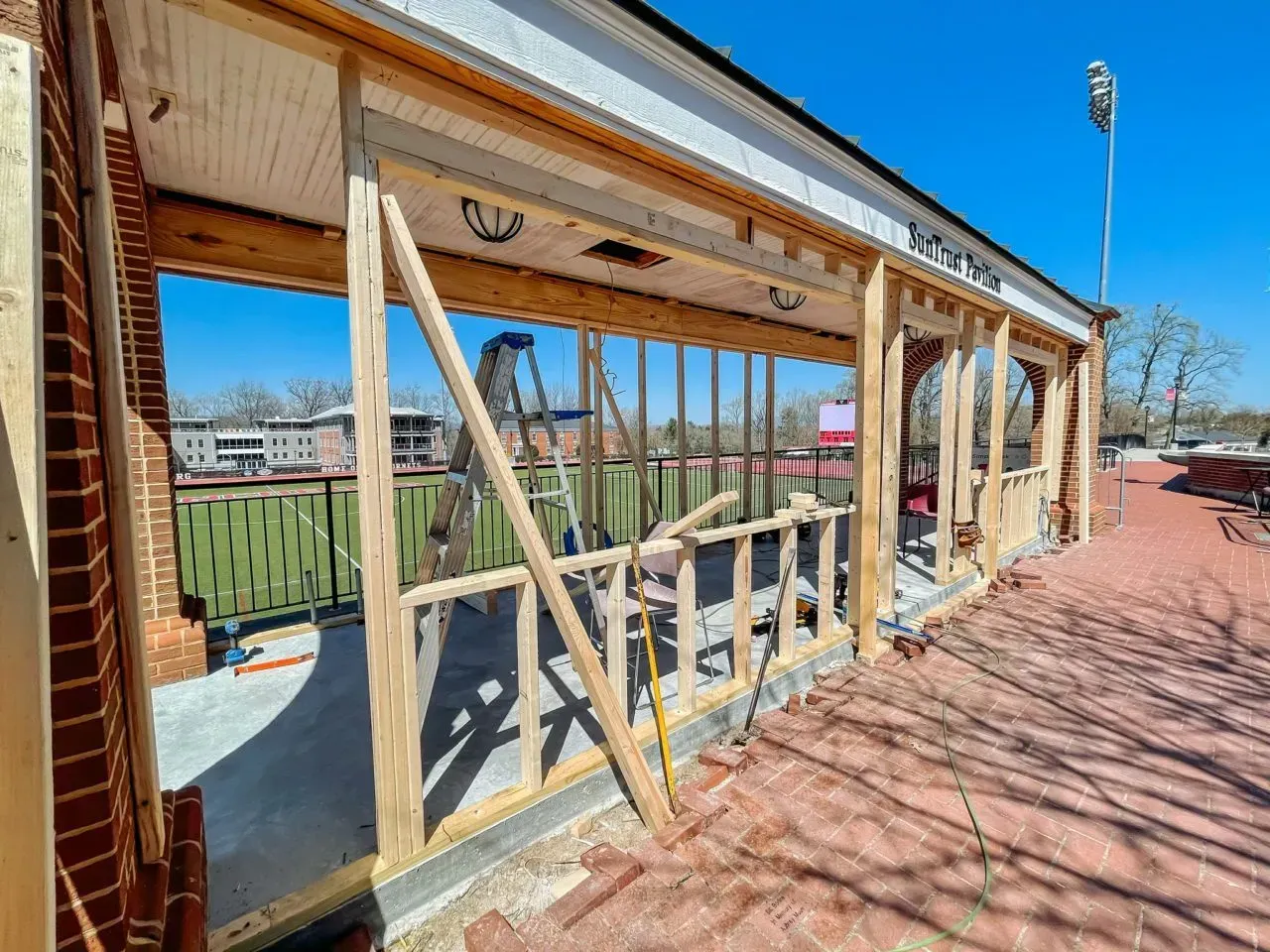 A building is being built with a lot of wood and bricks.