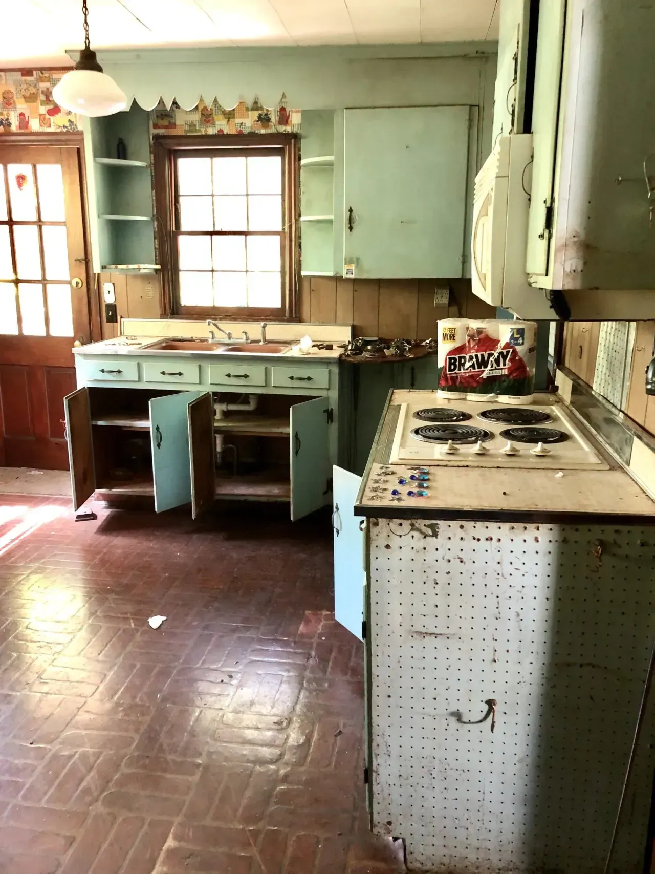 A kitchen with a pepsi box on the counter