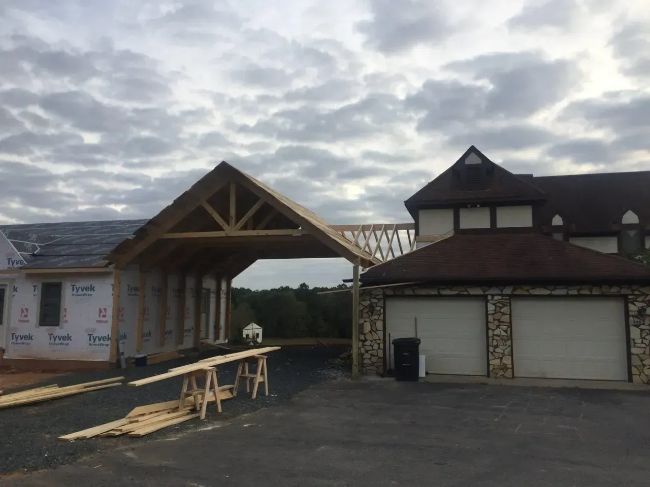 A house under construction with a wooden roof