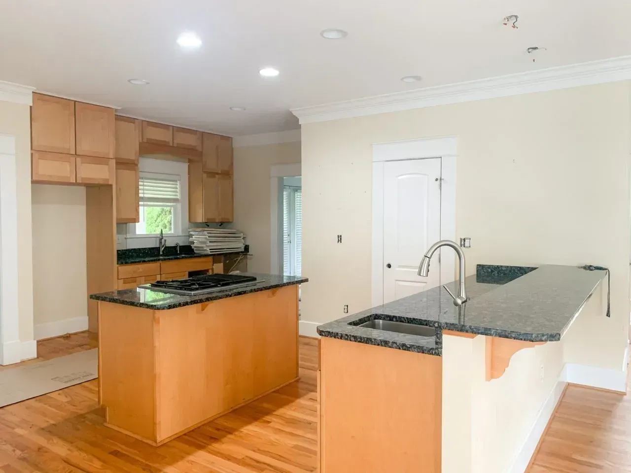 There is a large island in the middle of the kitchen.