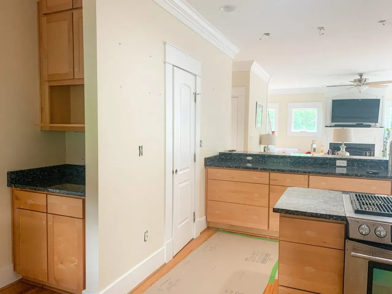 A kitchen with wooden cabinets and granite counter tops