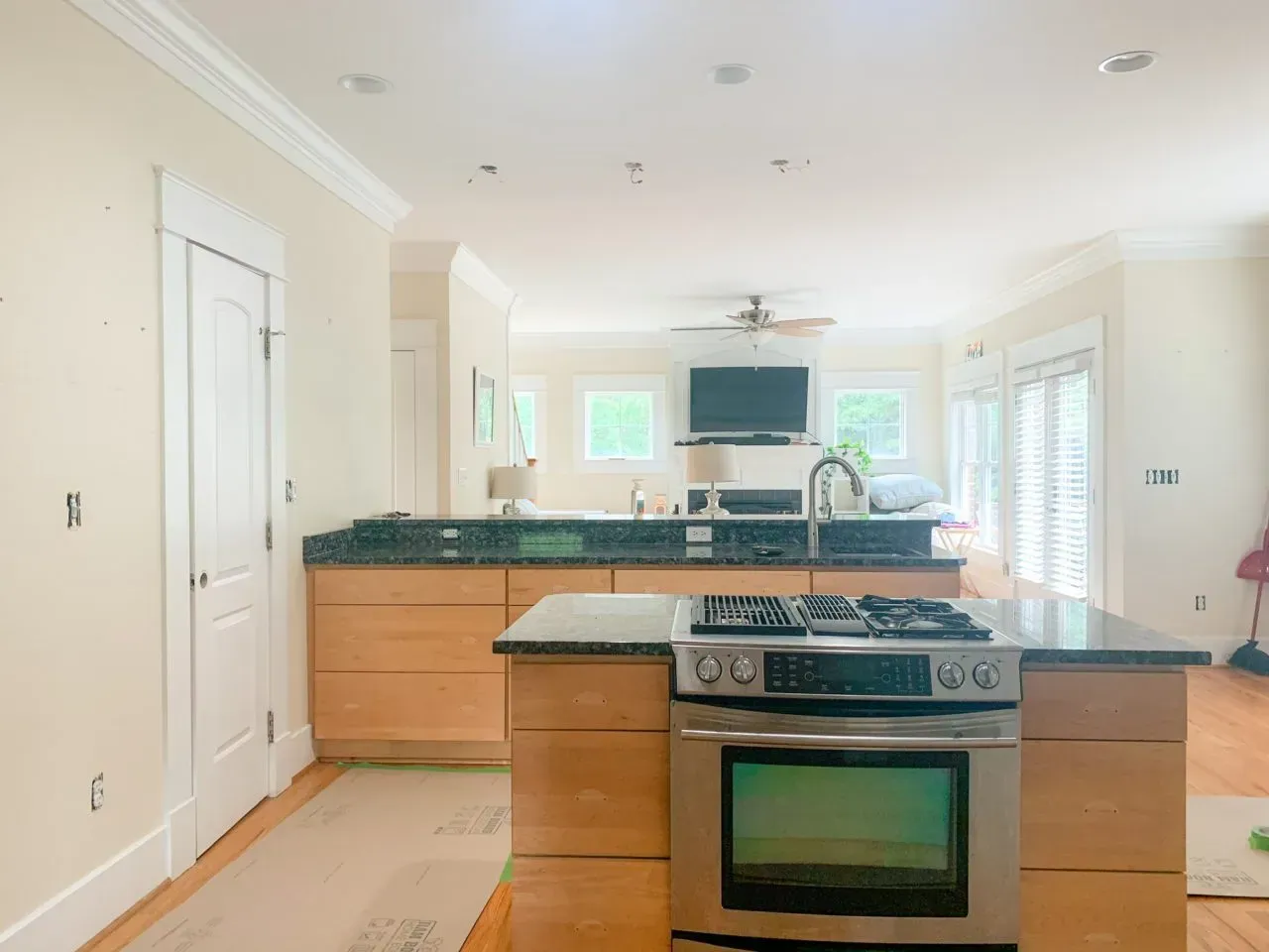 A kitchen with stainless steel appliances and wooden cabinets