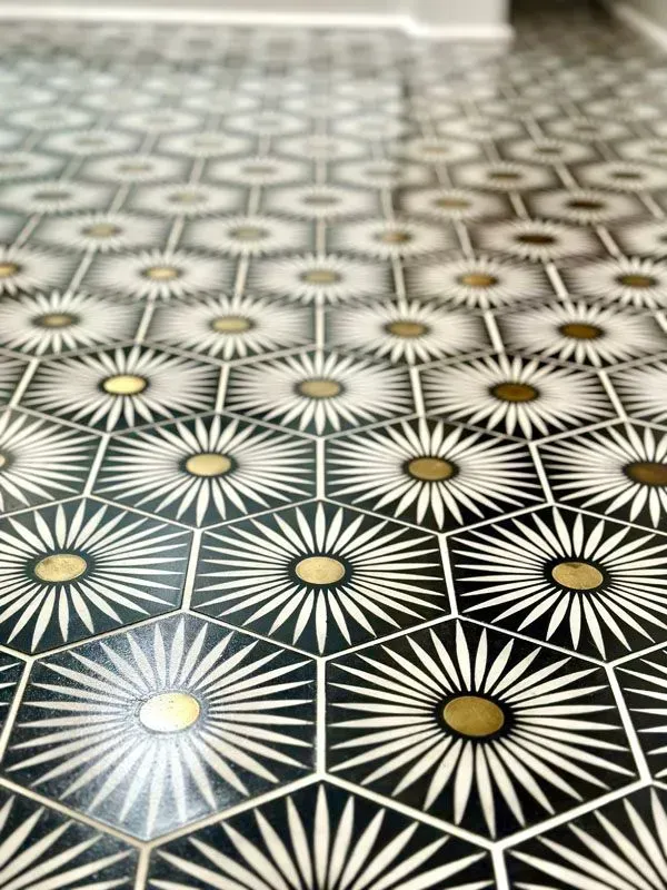 A black and white tile floor with a geometric pattern