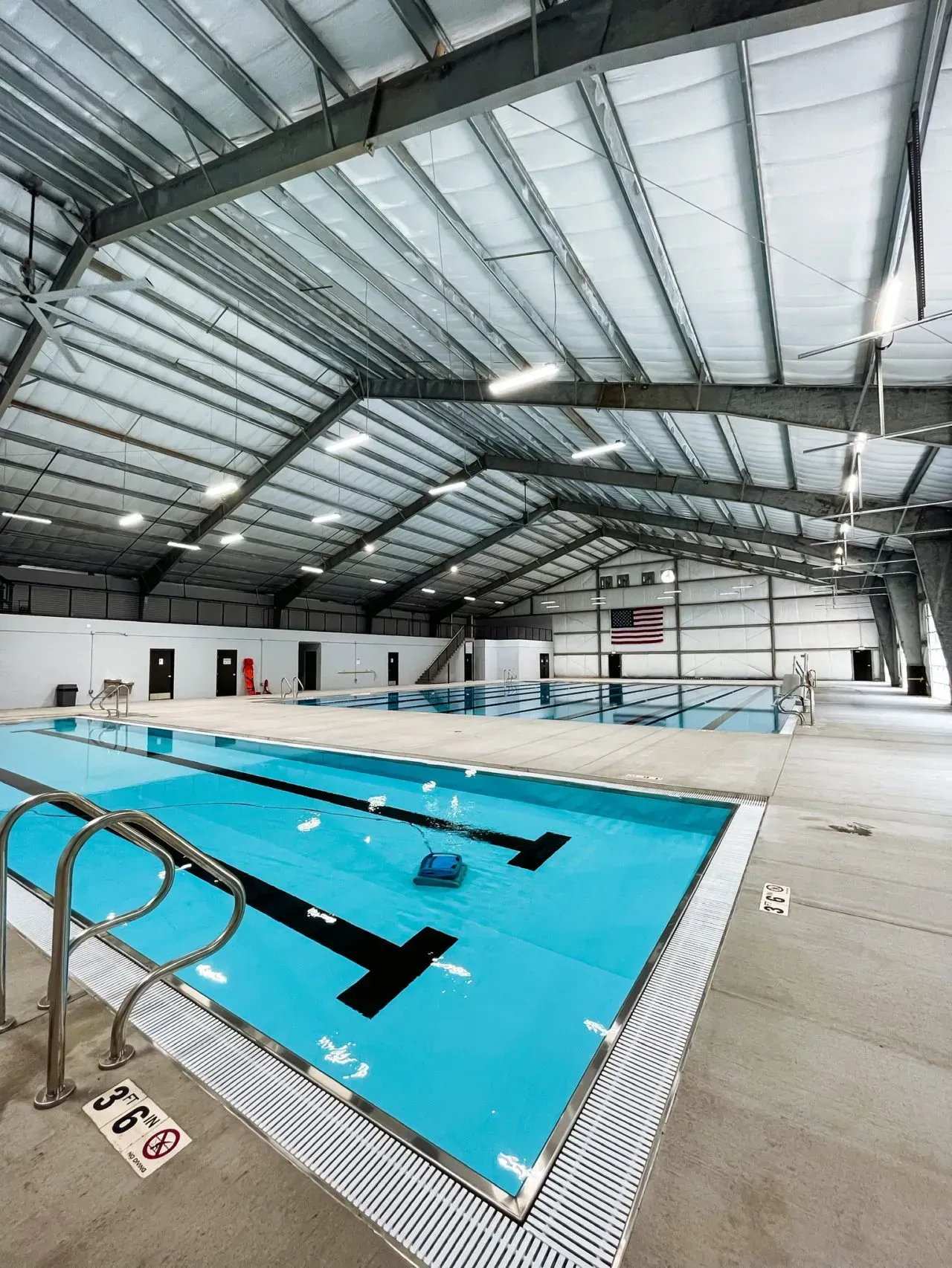 A large indoor swimming pool in a large building