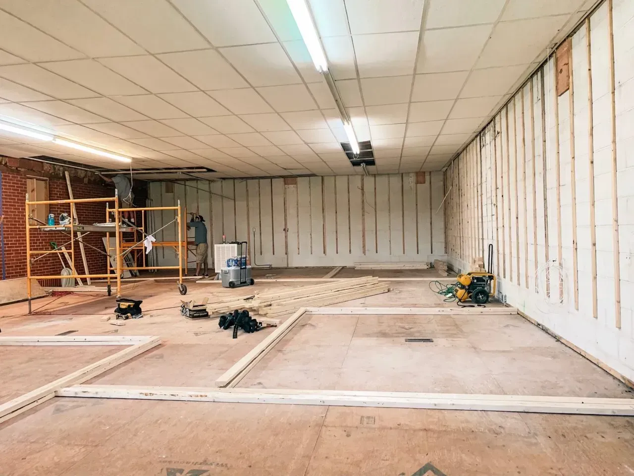 A large room with a ceiling that is being remodeled.