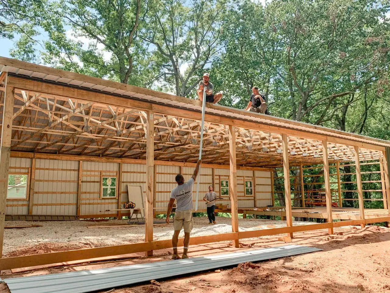 A group of people are working on the roof of a building.
