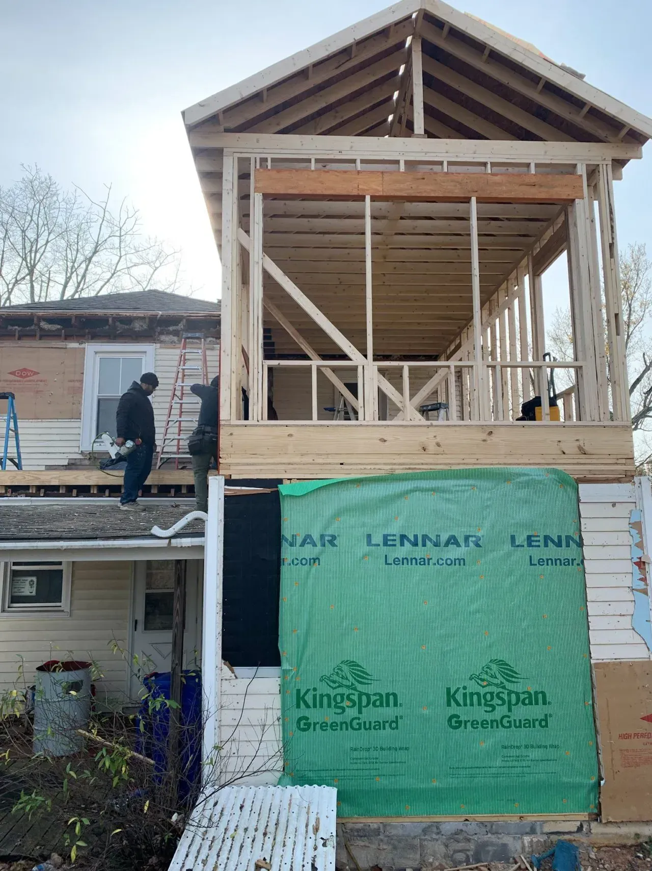 A house is being built with a second floor and a roof.