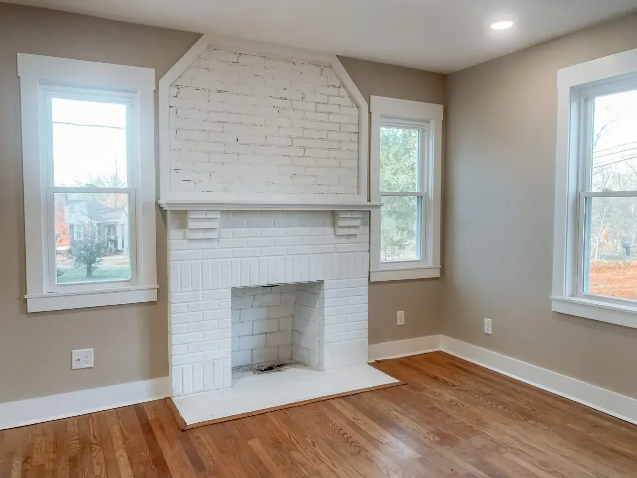 There is a fireplace in the middle of the room.