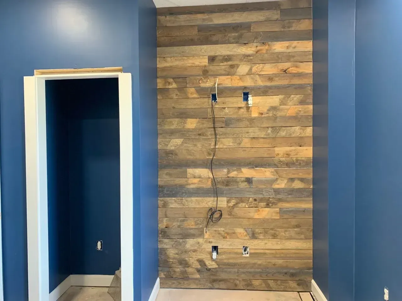 A room with blue walls and a wooden wall.