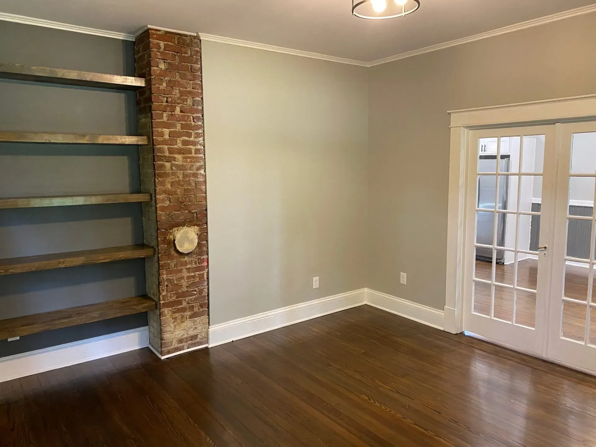 There is a brick wall in the middle of the room.