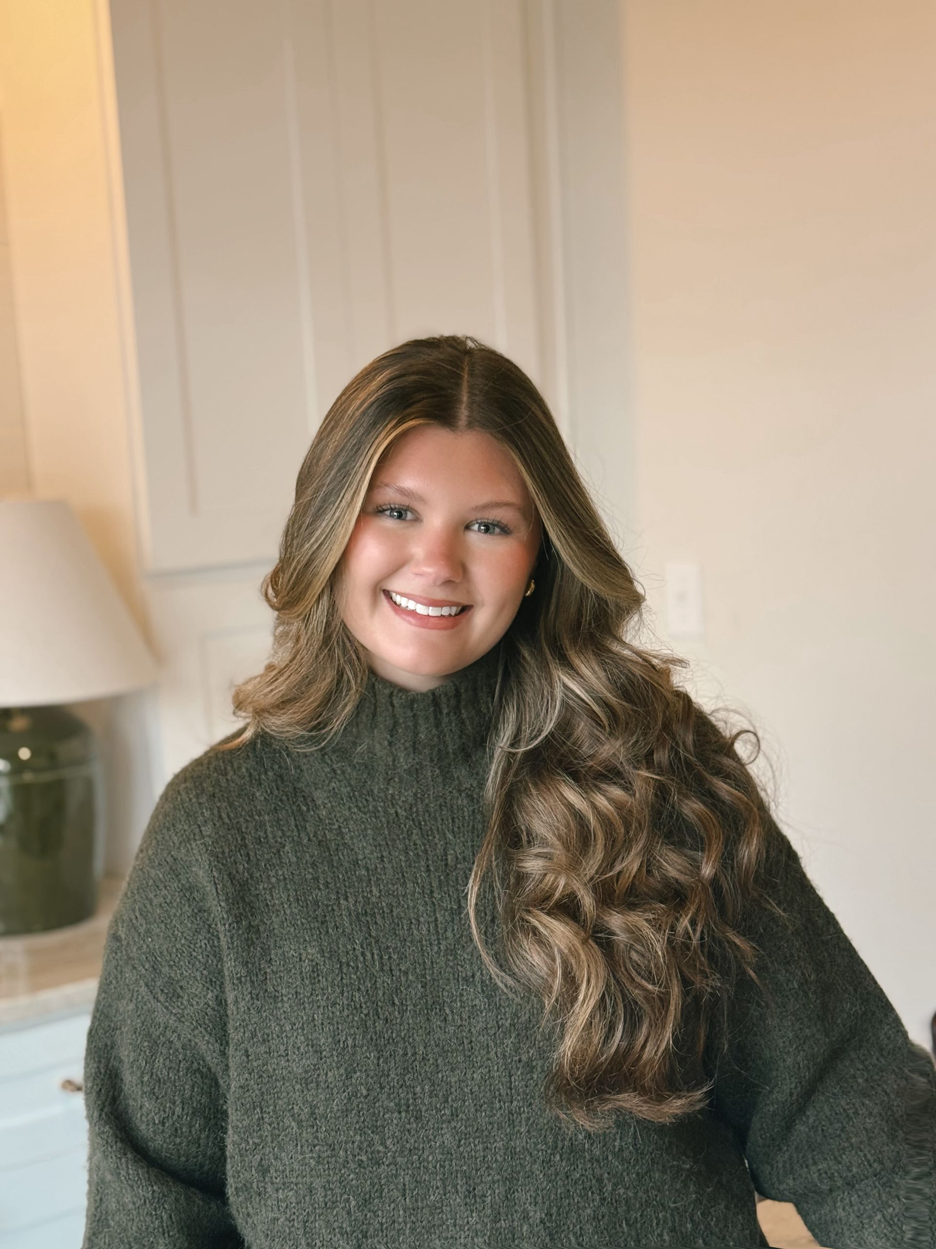 A man is using a circular saw to cut a piece of wood.