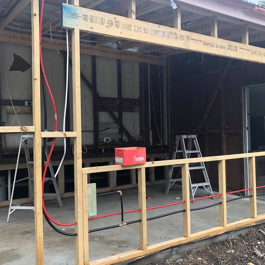 Construction Site With Exposed Wooden Framing and Electrical Wiring — Alcando Renovations and Maintenance In Taree, NSW