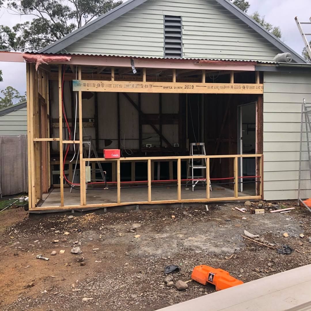 Construction in Progress: Wooden Frame Extension Attached to a Building — Alcando Renovations and Maintenance In Forster, NSW