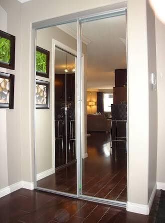 Mirrored Sliding Closet Doors With Silver Frames, Reflecting a Hallway — Alcando Renovations and Maintenance In Wingham, NSW