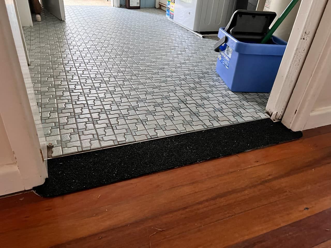 Wooden Floor Transitions to a Mosaic Tile Floor — Alcando Renovations and Maintenance In Old Bar, NSW